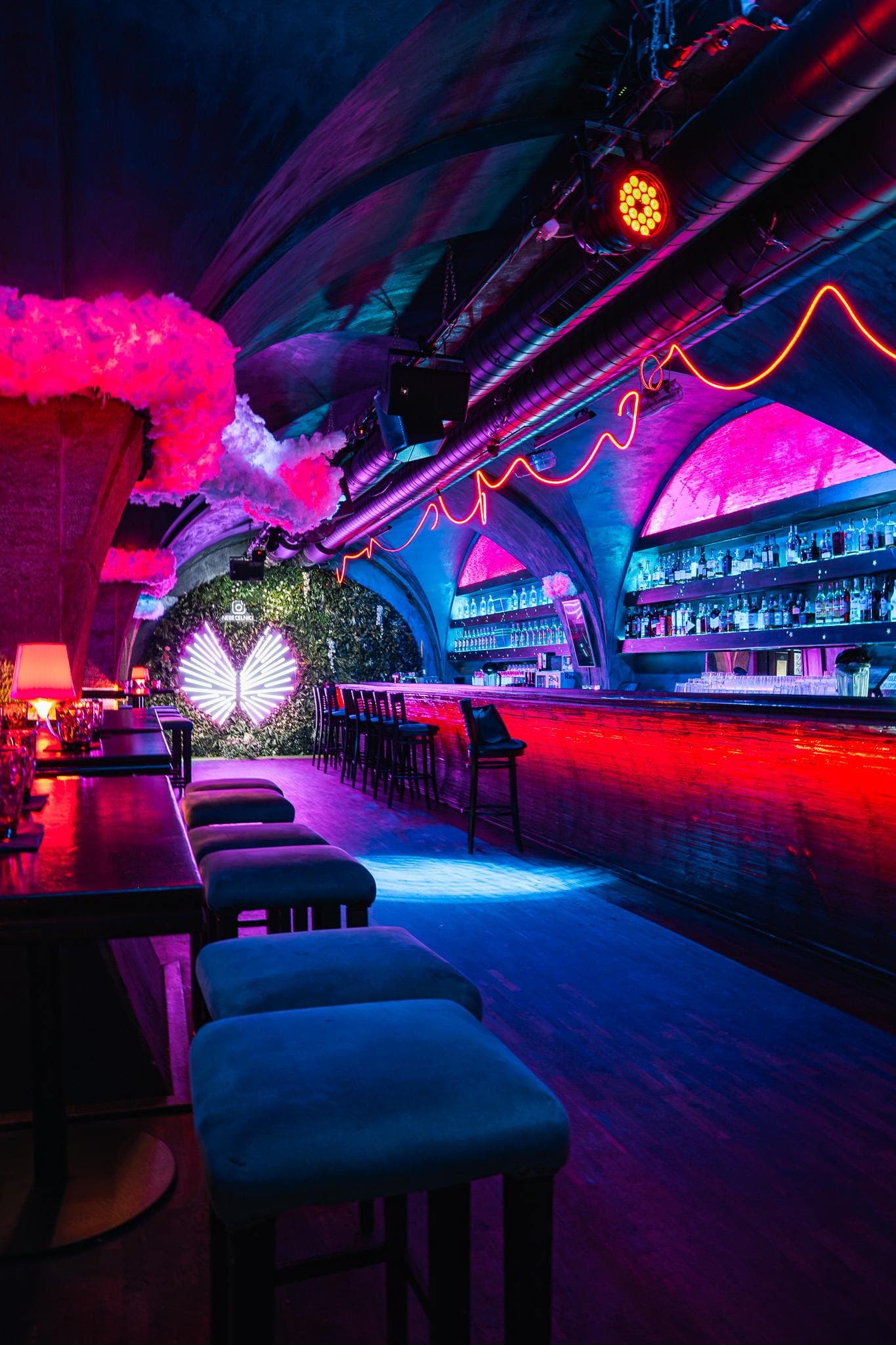The bar counter running under vaulted arches