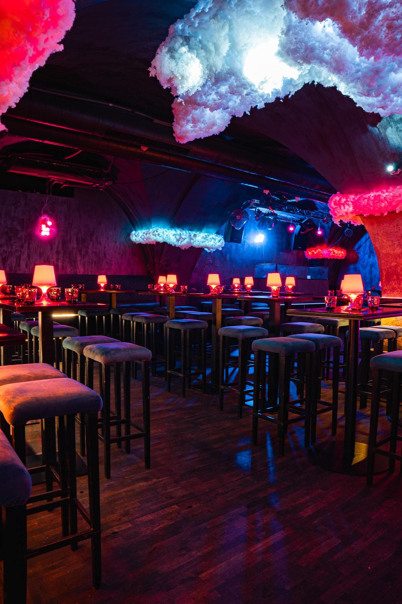 Glowing clouds hanging under the vault above the tables