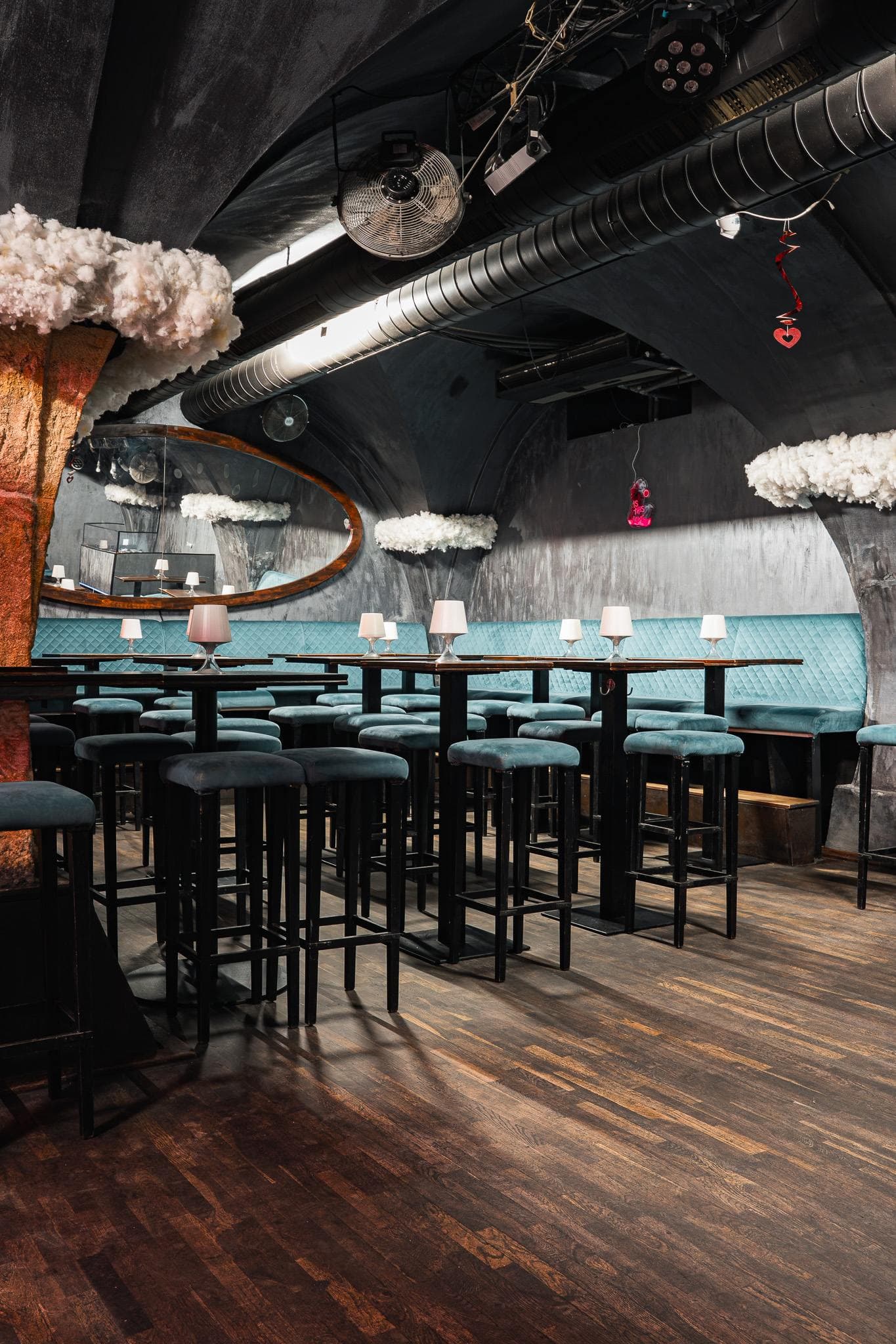 Copper column with a mirror and seating around it